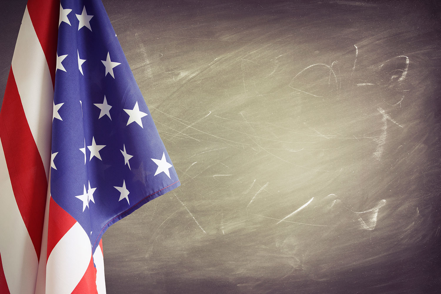 American flag in front of school chalkboard