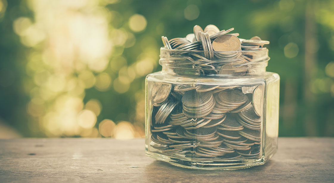 Jar of money with blurred background