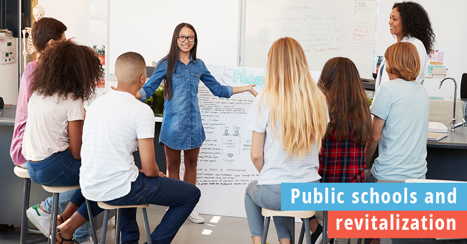 Public schools and economic revitalization, photo of student presenting in front of her peers