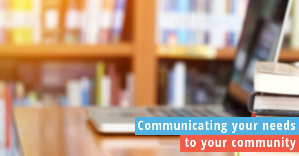 Communicating with your community, photo of laptop and books in a school library
